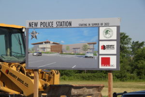 Sign with rendering of new Mokena Police Station and logos.