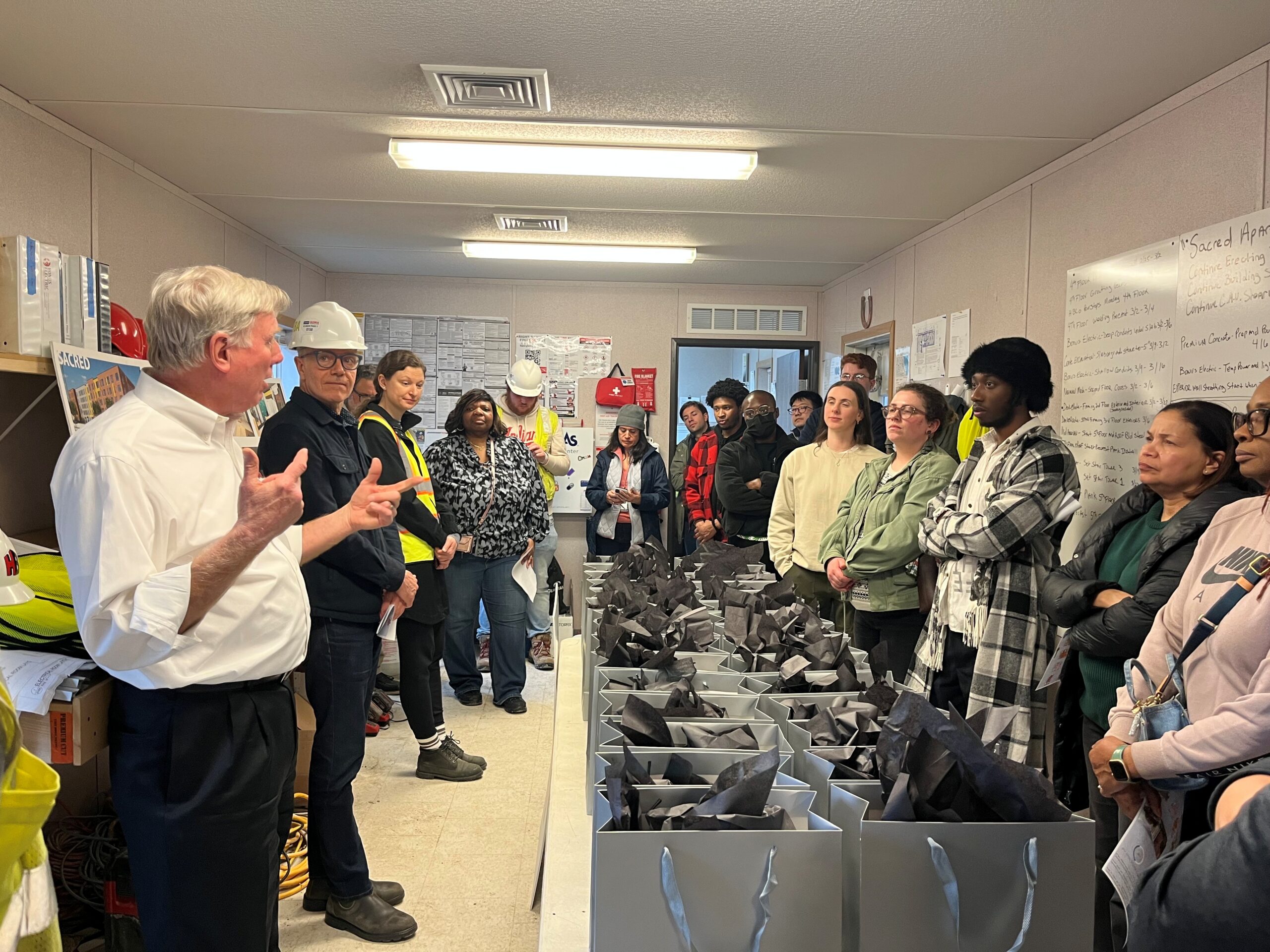 Henry Bros. Co. Hosts Group at SACRED Apartments Construction Site